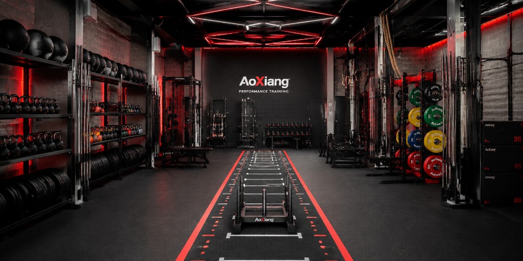 AoXiang performance training gym with sled track and strength equipment