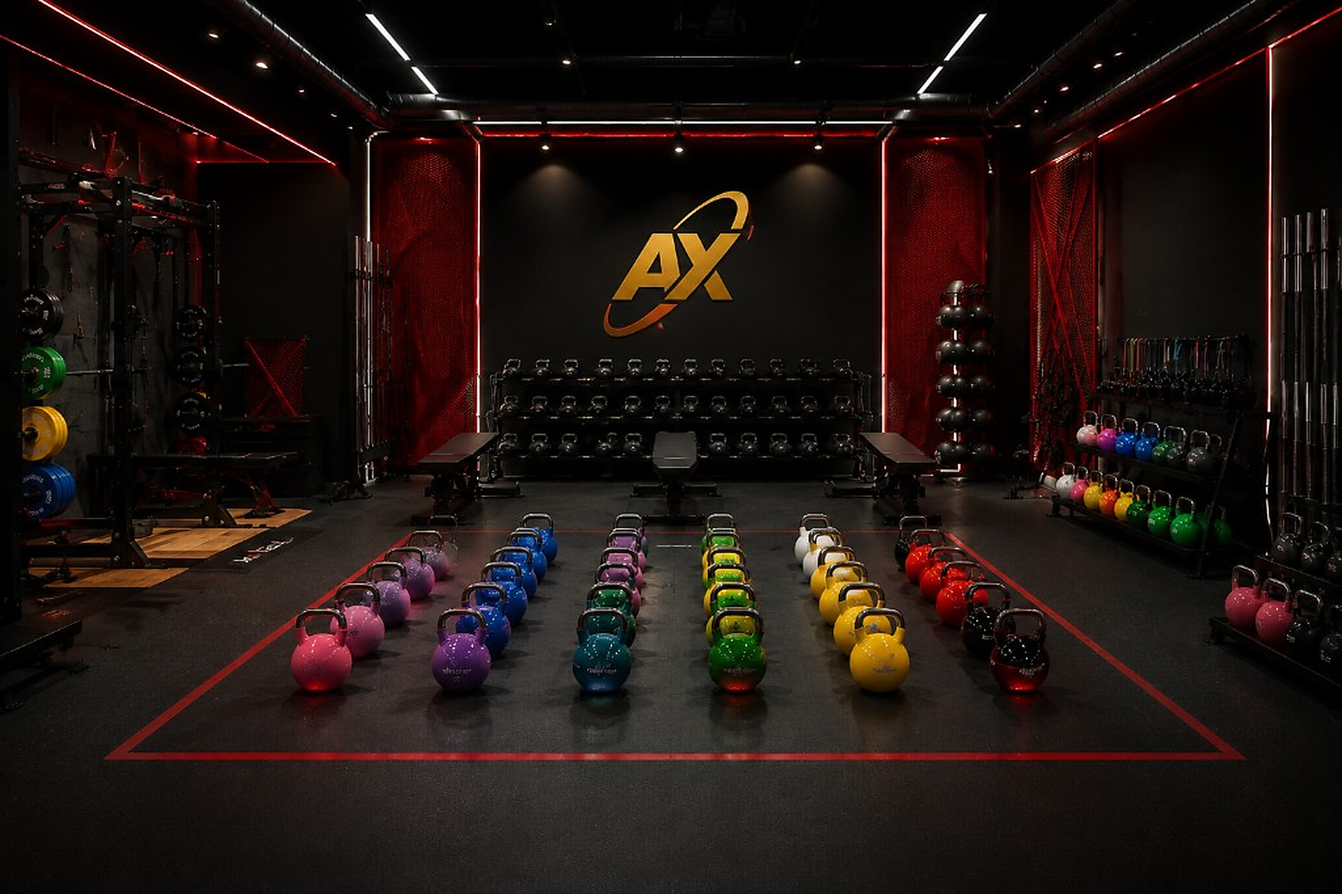 Open training deck with color-coded kettlebells